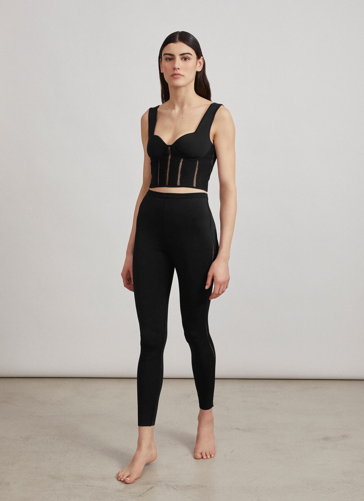 Cropped bustier in technical knit ALAÏA BLACK CROPPED BUSTIER IN TECHNICAL KNIT